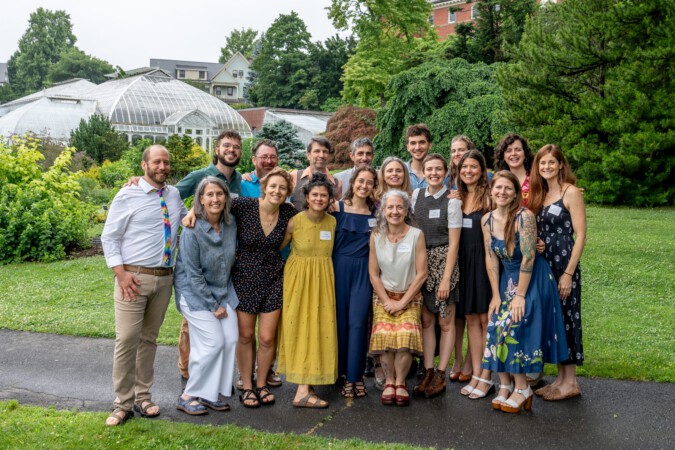 Group photo of the members of the Class of 2024, standing in the Botanic Garden of Smith College.
