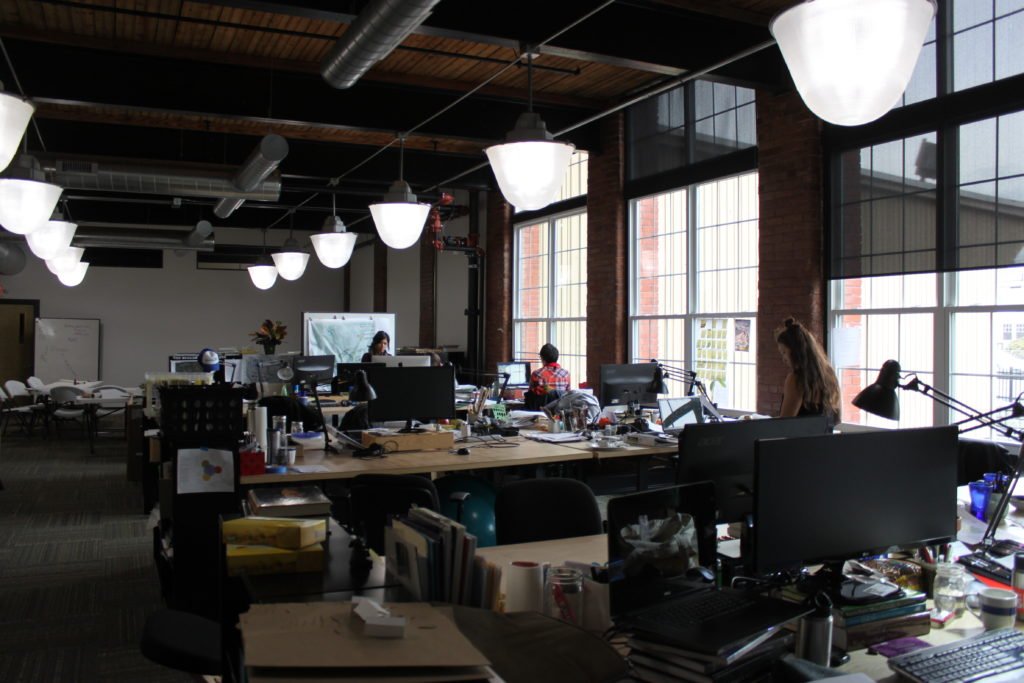 The renovated mill space is spacious and flexible, and the large windows provide ample natural light during the day.