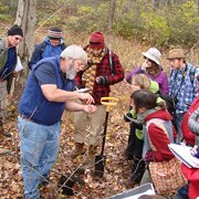 Bill Lattrell with students in field
